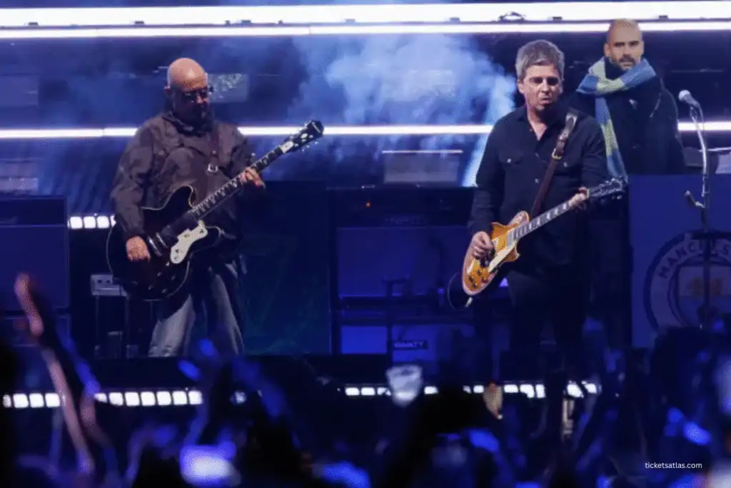 Paul “Bonehead” Arthurs on OASIS stage with Noel Gallagher